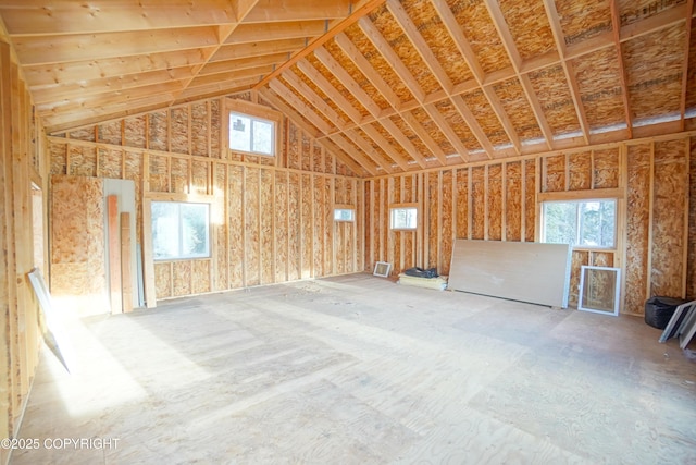 miscellaneous room with high vaulted ceiling