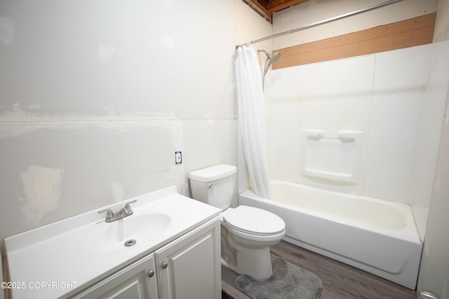 full bathroom with vanity, hardwood / wood-style floors, shower / bath combination with curtain, and toilet