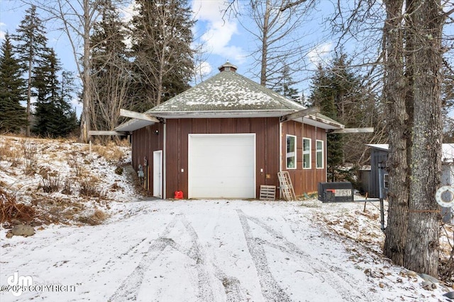 view of snow covered garage