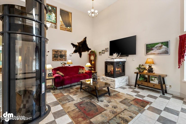 living room with a high ceiling and a chandelier