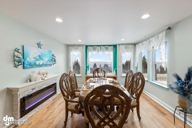 dining area featuring light hardwood / wood-style floors and a wealth of natural light