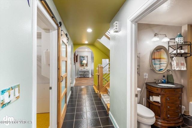 bathroom with vanity, toilet, and tile patterned flooring