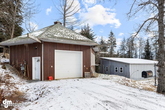 view of snow covered garage