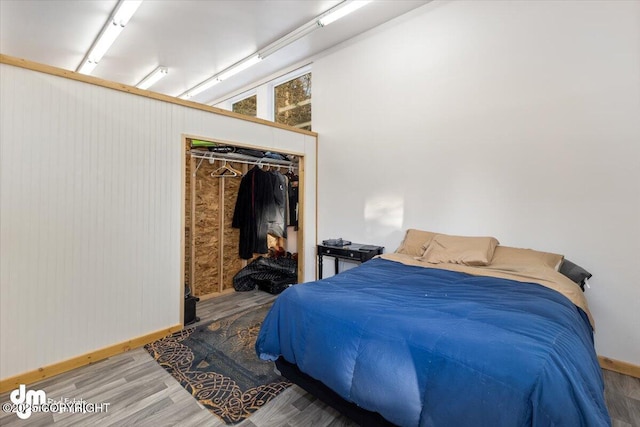 bedroom featuring hardwood / wood-style flooring and a closet