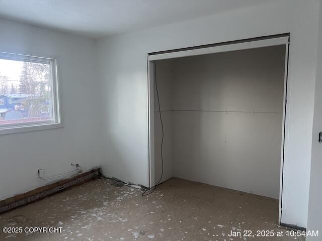 unfurnished bedroom featuring a closet