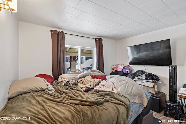 bedroom with wood-type flooring