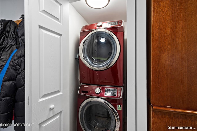 laundry area featuring stacked washer / dryer