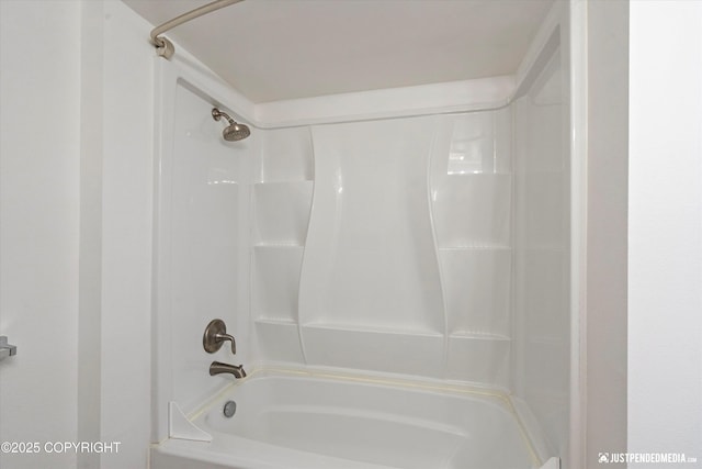 bathroom with shower / tub combination