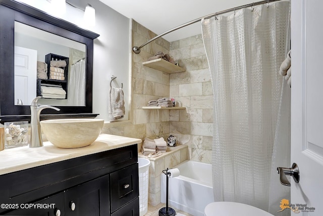 full bathroom featuring vanity, tile walls, shower / tub combo, and toilet