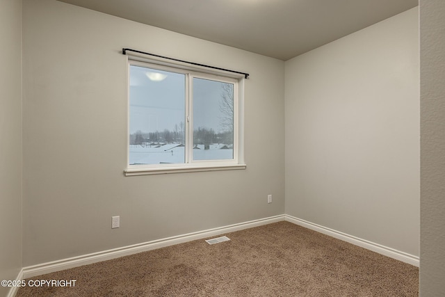 unfurnished room featuring carpet