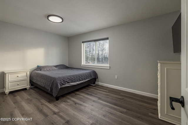 bedroom featuring dark hardwood / wood-style flooring