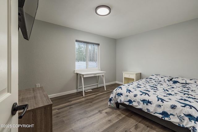 bedroom featuring dark hardwood / wood-style floors