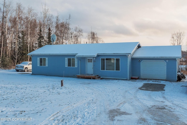 single story home featuring a garage