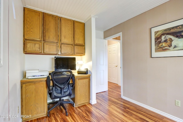 office space featuring hardwood / wood-style floors and ornamental molding