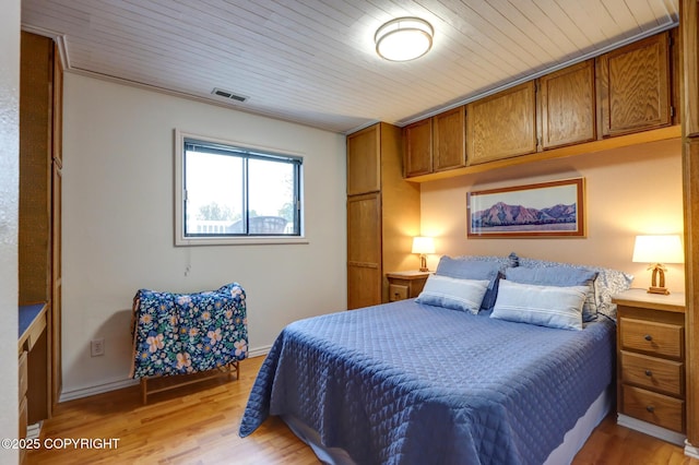 bedroom featuring wooden ceiling and light wood-type flooring