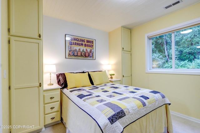 bedroom with light colored carpet