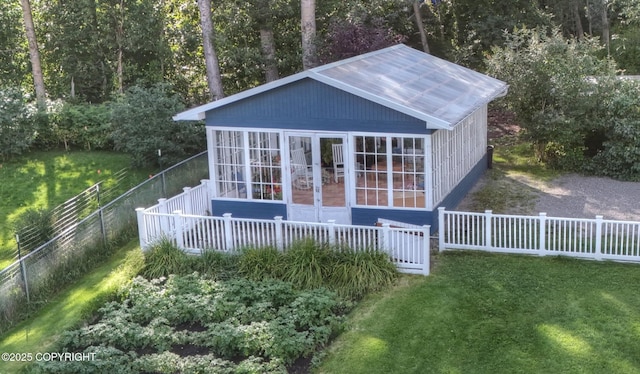 view of outbuilding with a yard