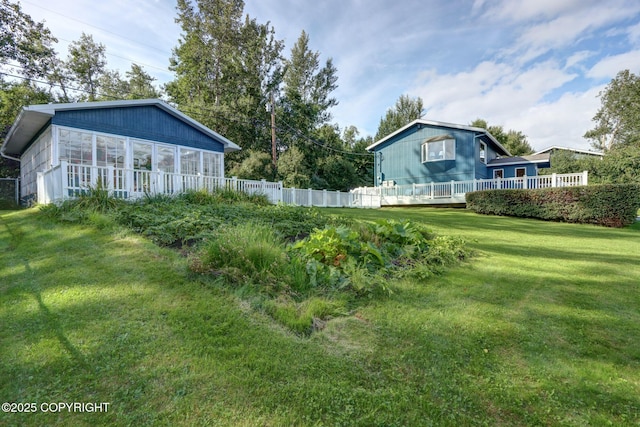 view of yard with a sunroom