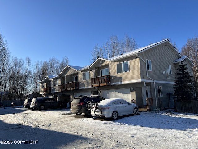 view of front of property with a garage and a balcony