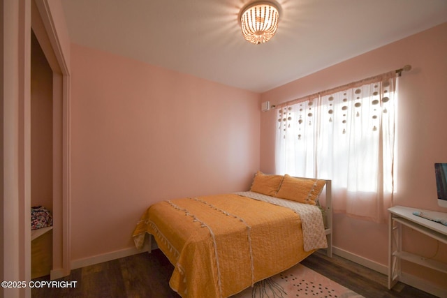 bedroom with dark wood-type flooring