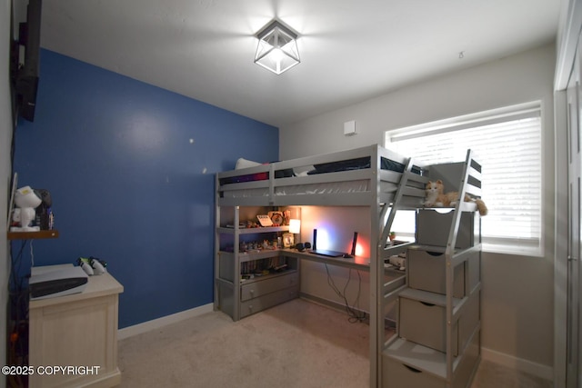 bedroom featuring light colored carpet