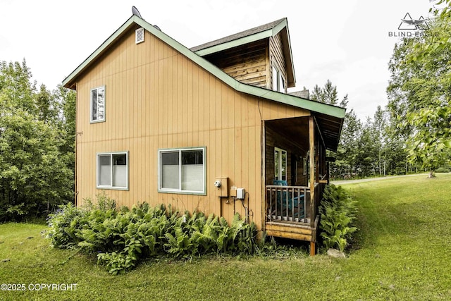 6976 W Windsor Dr, Wasilla, AK 99623 - view of side of property featuring a yard