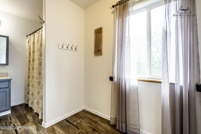 6976 W Windsor Dr, Wasilla, AK 99623 - corridor featuring dark wood-style floors