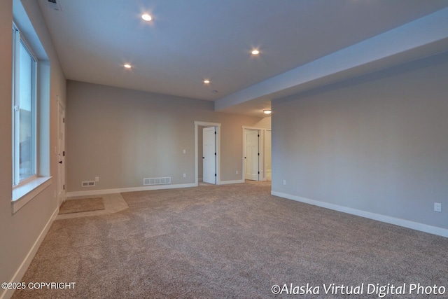 unfurnished room with light carpet