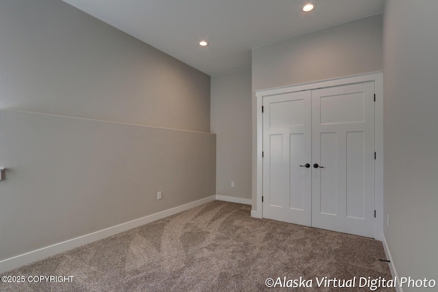 unfurnished bedroom featuring a closet and carpet