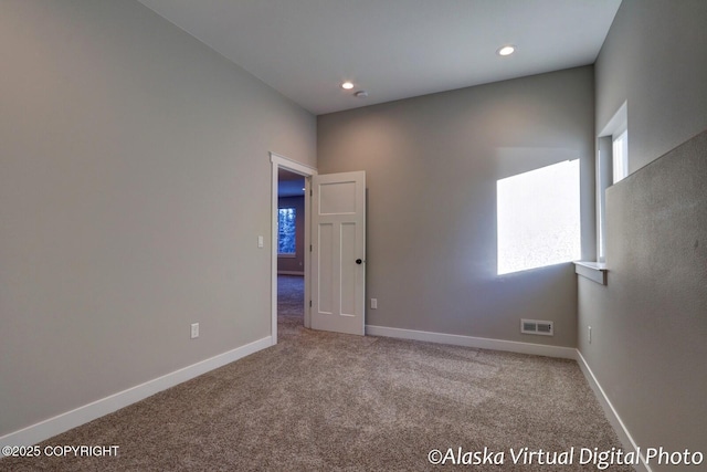 unfurnished room featuring carpet floors