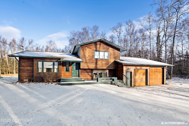 split level home with a garage