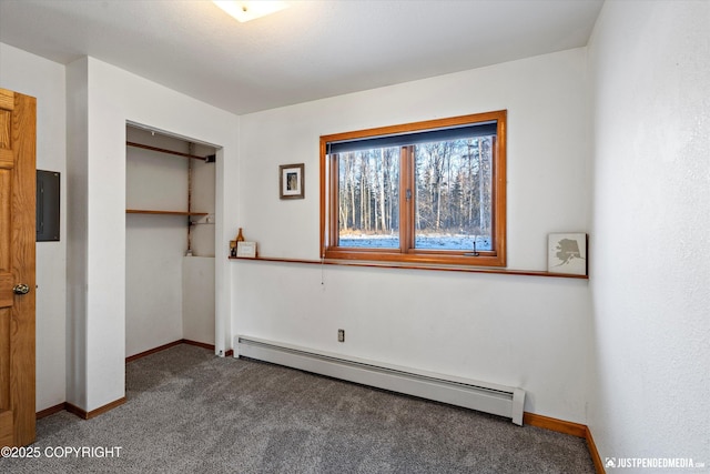 unfurnished bedroom featuring carpet floors, electric panel, a closet, and baseboard heating