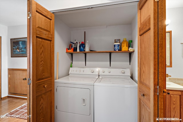 washroom featuring separate washer and dryer and hardwood / wood-style floors