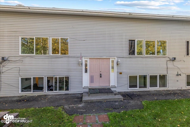 back of house with entry steps