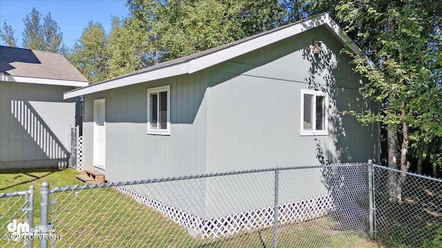 view of side of home featuring a lawn