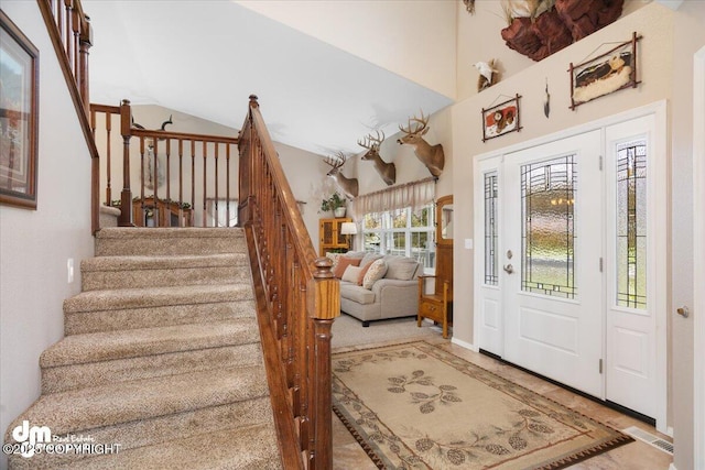 foyer entrance with a high ceiling