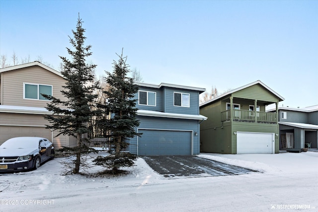 view of front property featuring a garage and a balcony