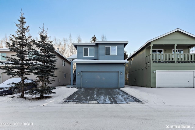 view of property featuring a balcony and a garage