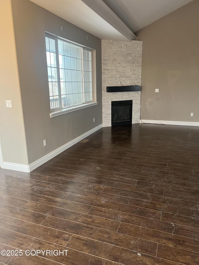 unfurnished living room featuring a fireplace and dark hardwood / wood-style floors