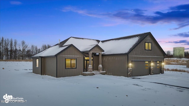 modern farmhouse style home featuring a garage