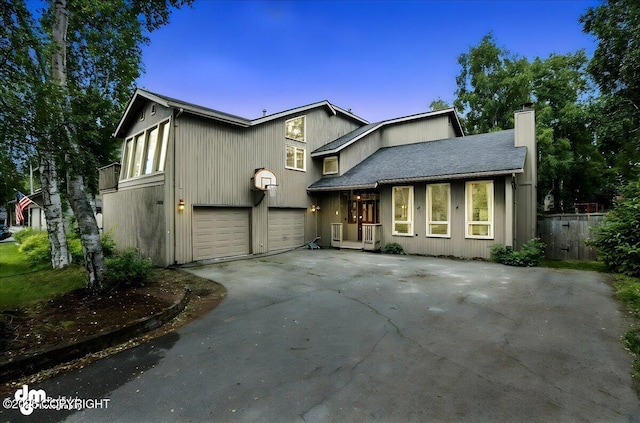 2629 Legacy Dr, Anchorage, AK 99516 - view of front facade featuring a chimney, driveway, and an attached garage