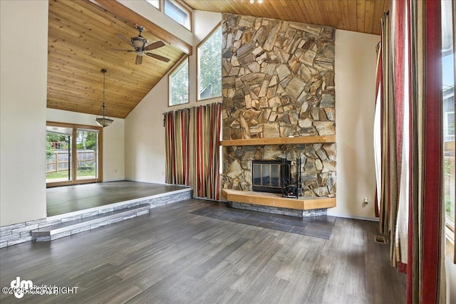 2629 Legacy Dr, Anchorage, AK 99516 - unfurnished living room featuring high vaulted ceiling, wooden ceiling, wood finished floors, ceiling fan, and a stone fireplace