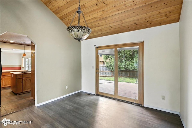 2629 Legacy Dr, Anchorage, AK 99516 - unfurnished dining area with dark wood-style flooring, plenty of natural light, wooden ceiling, high vaulted ceiling, and arched walkways