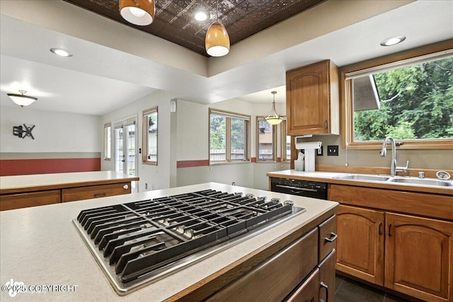 2629 Legacy Dr, Anchorage, AK 99516 - kitchen with stainless steel gas cooktop, black dishwasher, light countertops, recessed lighting, and plenty of natural light