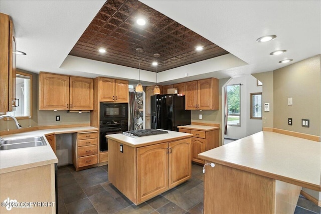 2629 Legacy Dr, Anchorage, AK 99516 - kitchen featuring black appliances, a tray ceiling, a center island, light countertops, and recessed lighting