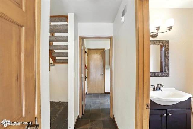 2629 Legacy Dr, Anchorage, AK 99516 - corridor featuring a sink and stairway