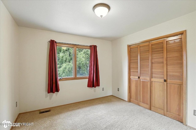 2629 Legacy Dr, Anchorage, AK 99516 - unfurnished bedroom featuring carpet flooring and a closet