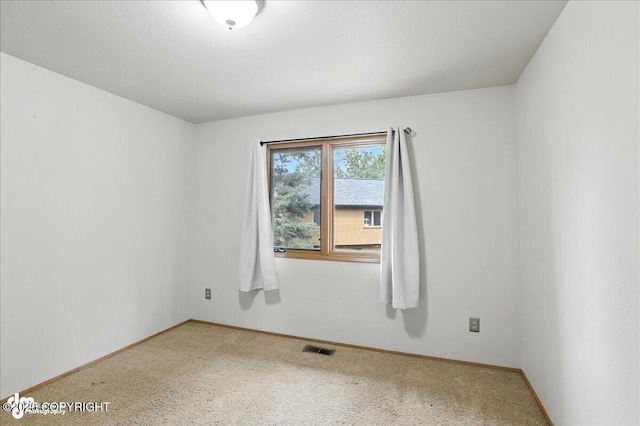 2629 Legacy Dr, Anchorage, AK 99516 - carpeted spare room featuring baseboards