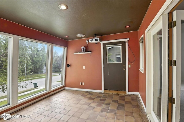 2629 Legacy Dr, Anchorage, AK 99516 - unfurnished sunroom with plenty of natural light and a baseboard radiator