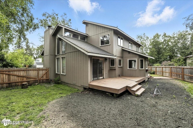 2629 Legacy Dr, Anchorage, AK 99516 - rear view of property featuring a chimney, a fenced backyard, and a deck